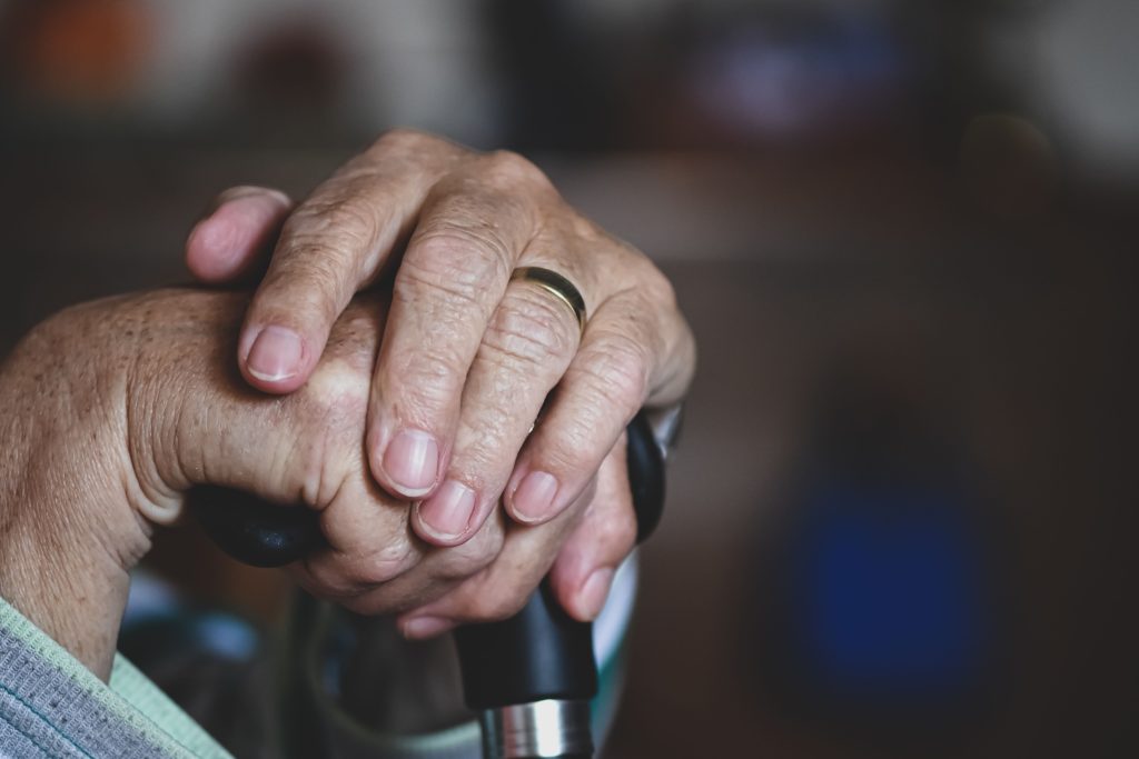 Senior hands representing comfort and dignity