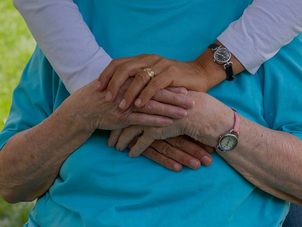 Senior and family member sharing a caring moment together.